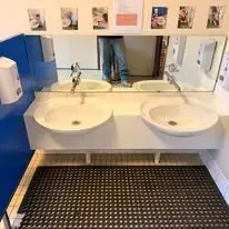 Twin-basin vanity and mirror.
