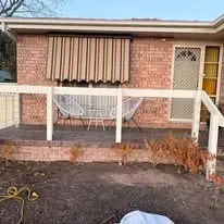 Patio awning, posts and rail.